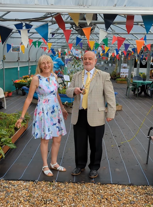 mayor Town Mayor and Patti opening community garden competition